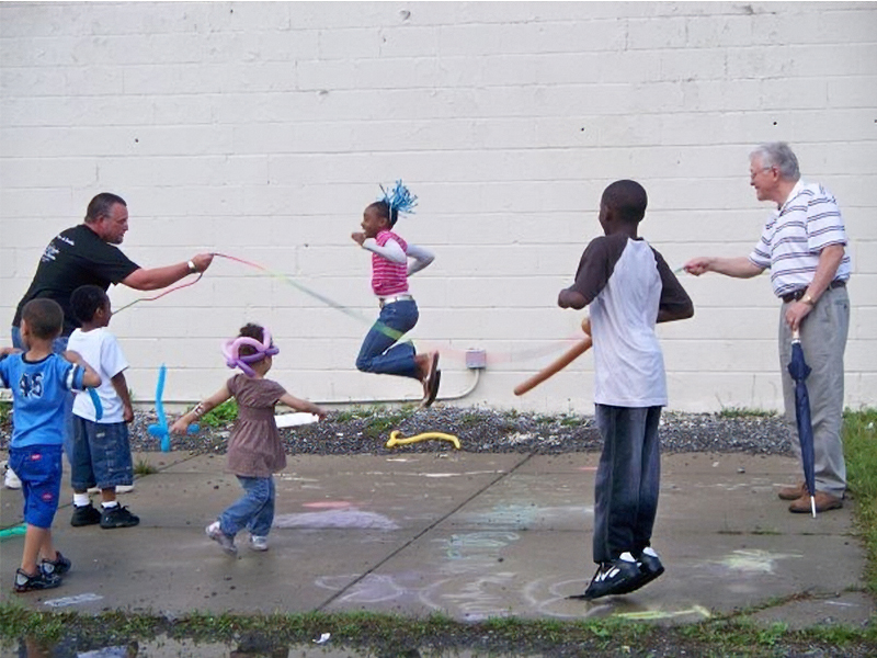 kids and adults skipping rope