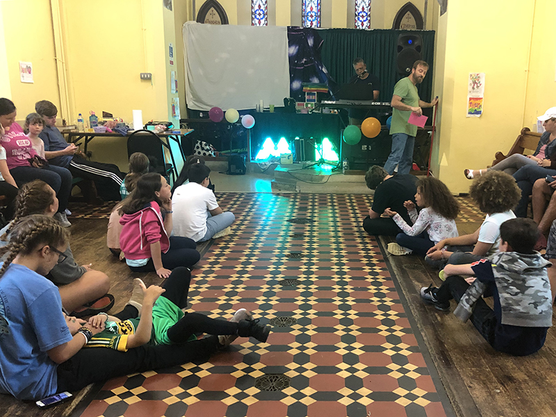 Children sitting listening to a great speaker!