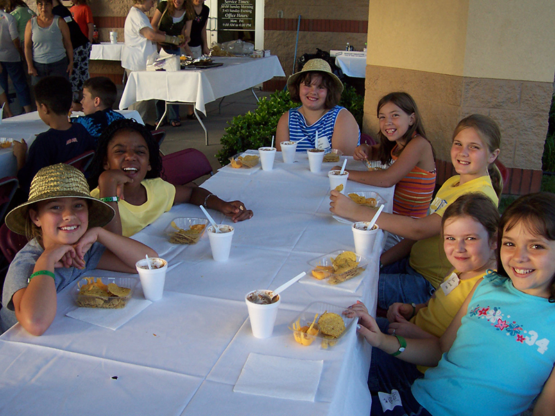 7 girls eating snack at VBS